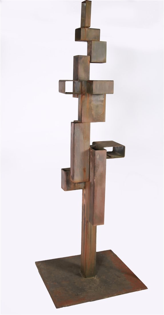Steel Geometric Abstract Sculpture: Welded steel. Height: 70 1/2", Length: 24", Depth: 21 1/4". Geometric abstract steel sculpture. Steel has been patinated. Hollow blocks are stacked to create height. Signed to the base in molten metal
