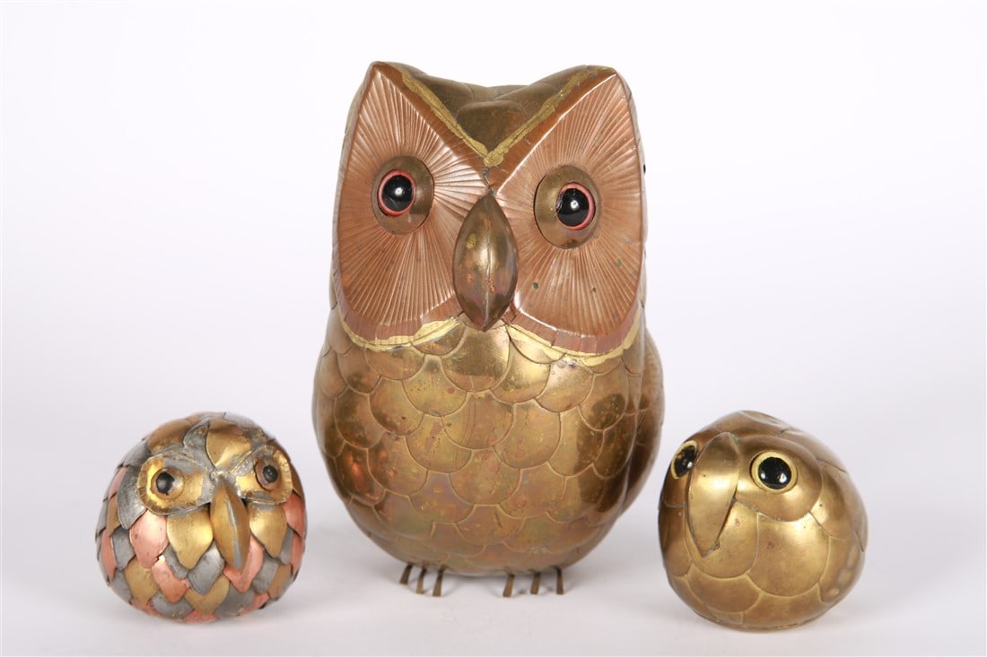 Attrib. Sergio Bustamante, Three Metal Owls: Attributed to Sergio Bustamante. Cut metal, glass. Tallest: Height: 6 1/4", Length: 4", Depth: 4 1/2". Two smaller: Height: 2 1/4", Diameter: 3". Collection of three cut metal owls attributed to Sergi