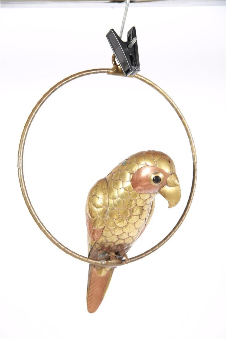 Attrib. Sergio Bustamante, Small Brass Bird: Attributed to Sergio Bustamante (Mexico, b. 1949). Brass, metal. Height (including stand): 11", Length (stand): 8 1/4", Depth: 5". Brass small bird sculpture mounted on a circle hoop stand. Bird comes