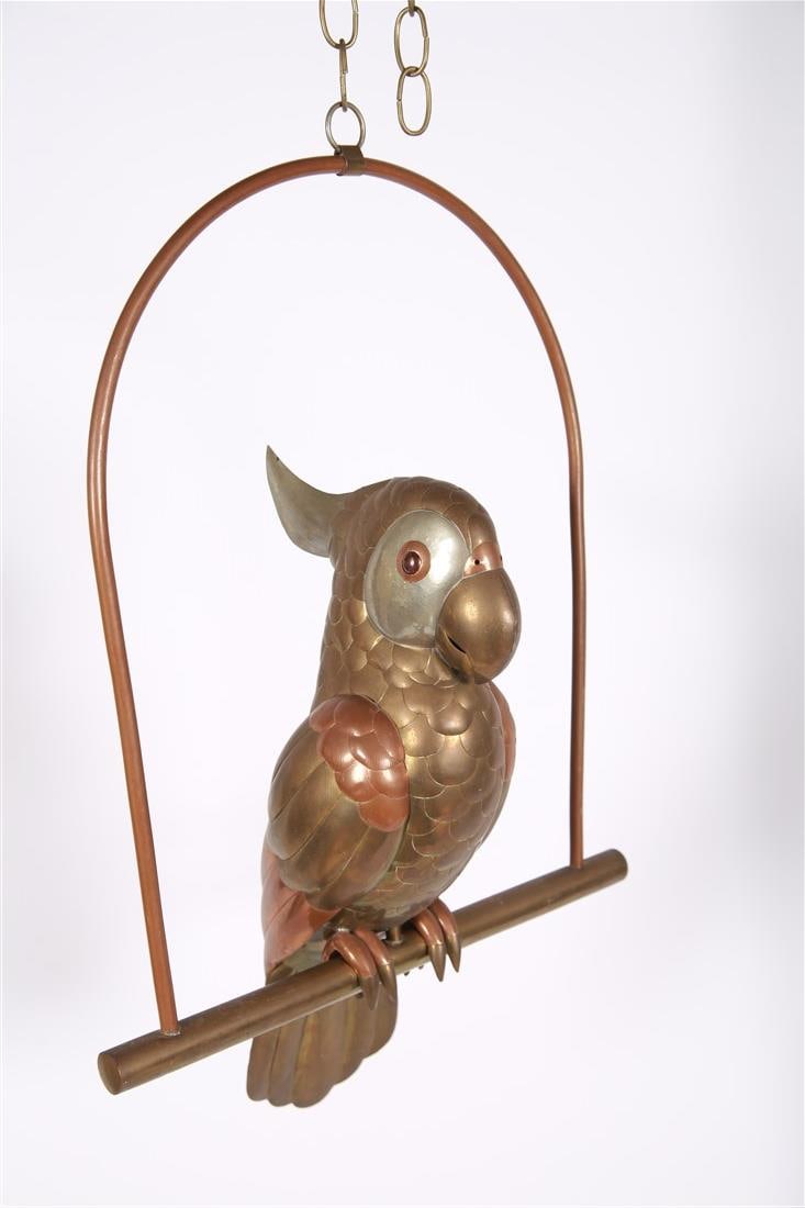 Attrib. Sergio Bustamante, Brass Cockatoo: Attributed to Sergio Bustamante (Mexico, b. 1949). Brass, metal. Height (including stand): 24", Length (stand): 15 3/4", Depth: 8". Brass cockatoo sculpture mounted on an arc stand. Bird comes off of
