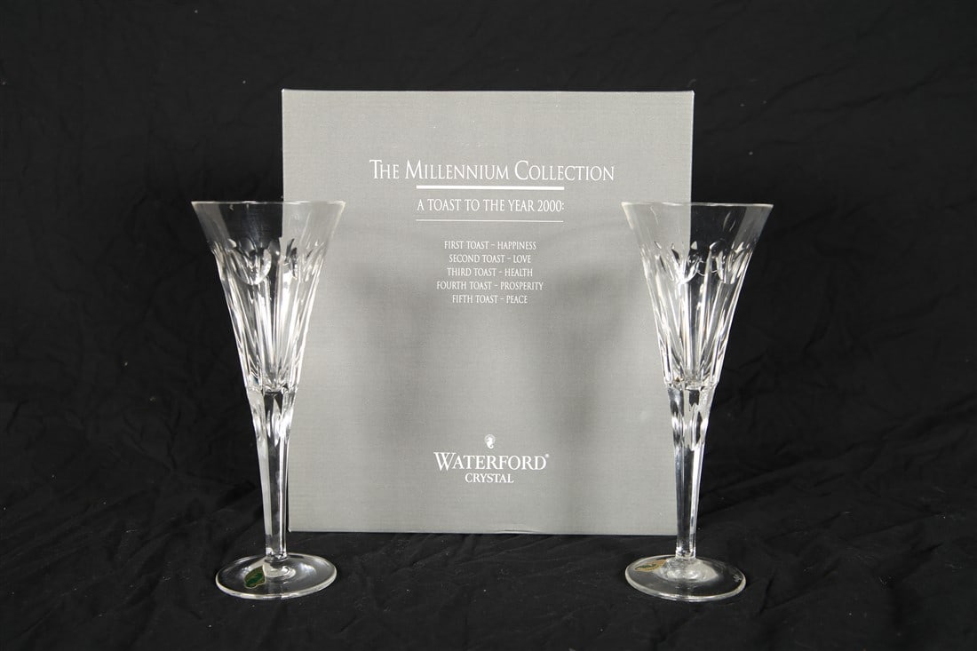 Waterford, Pair of "Love" Champagne Flutes: Waterford (Irish, established 1783). "Millenium Collection". Crystal. Box dimensions: 4" x 12" x 11". Height: 9 1/4". Pair of "Love" champagne flutes from "The Millenium Collection" by Waterford. Thes