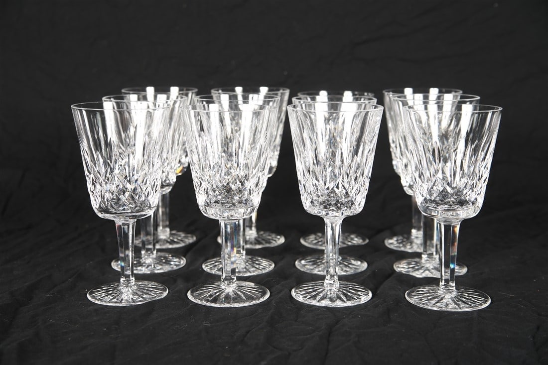 Waterford, Set of Twelve "Lismore" Water Goblets: Waterford (Irish, established 1783). "Lismore". Crystal. Height: 6 7/8". Set of twelve Waterford "Lismore" crystal water goblets. Etched Waterford insignia to the underside.
