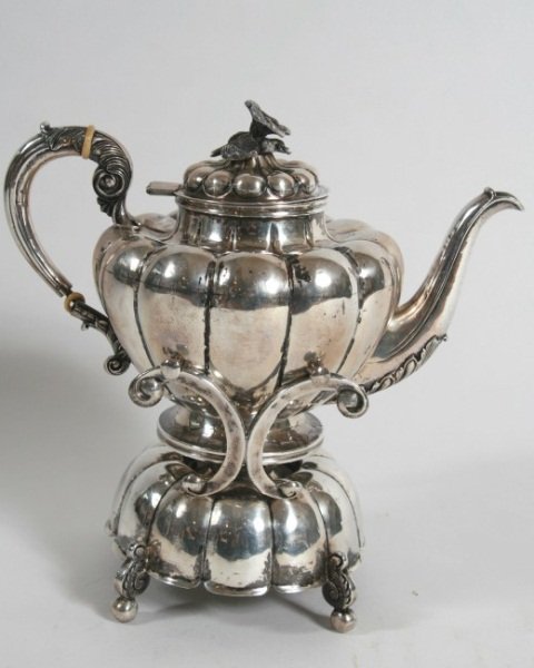 Sterling Tea Kettle with Burner Stand, 61 Ozt.: Sterling silver tea kettle on burner stand. Mexican, 20th century. Globular lobed tea kettle mounted with floral finial. 61 troy ounces. Height 11 1/2".