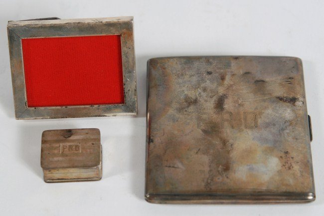 Group of 20th C. Sterling Items, 3 Ozt. Weighable: Group of sterling silver items. 20th century. Including cigarette case, pill box, and a small picture frame. 3 troy ounces weighable. Cigarette case 3 1/2" x 3", frame 2 1/2" x 2".