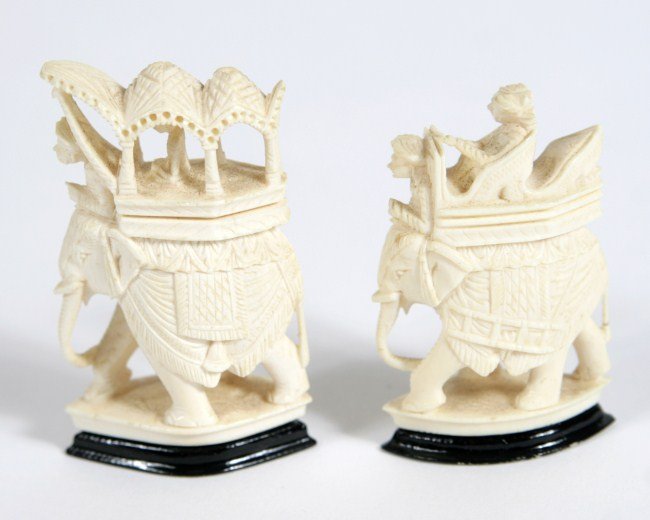 Two Carved Ivory Elephants, 20th C.: Two carved ivory figures of elephants. Indian, 20th c. Height 3".