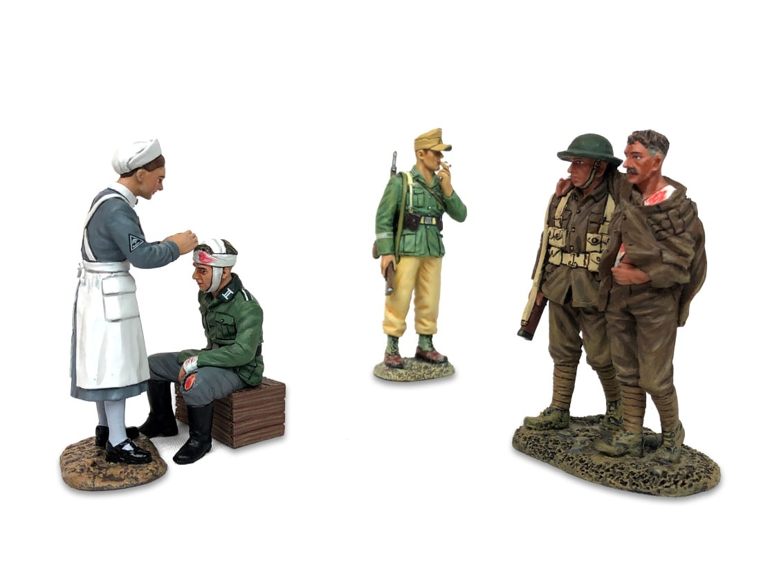 Set of Three King & Country Figure Sets: Set Includes #AK137 Guard Duty #FW165 Walking Wounded # WS264 Now This Might Hurt a Little… Painted metal. Complete in box.