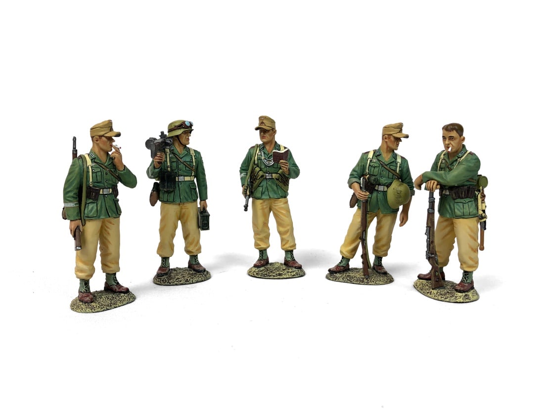 Set of 4 King & Country Figurines: Set includes: AK137 - Guard Duty AK140 - Field Police Checking Papers AK135 - MG34 Machine Gunner AK136 - At Ease Painted metal. Complete in box.