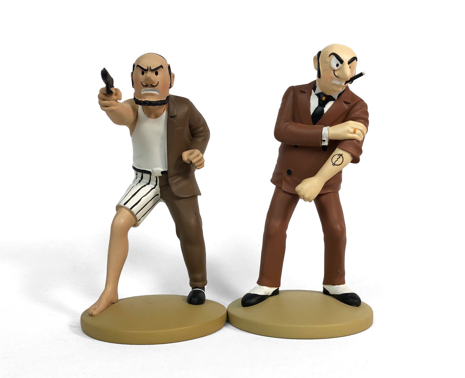 The Hergé Foundation - Two Tintin Figurines: Lot includes two resin figurines from the Tintin comic book series created by Georges Remi. Characters: Alonzo Parez and Rastapopoulos.No original box included.