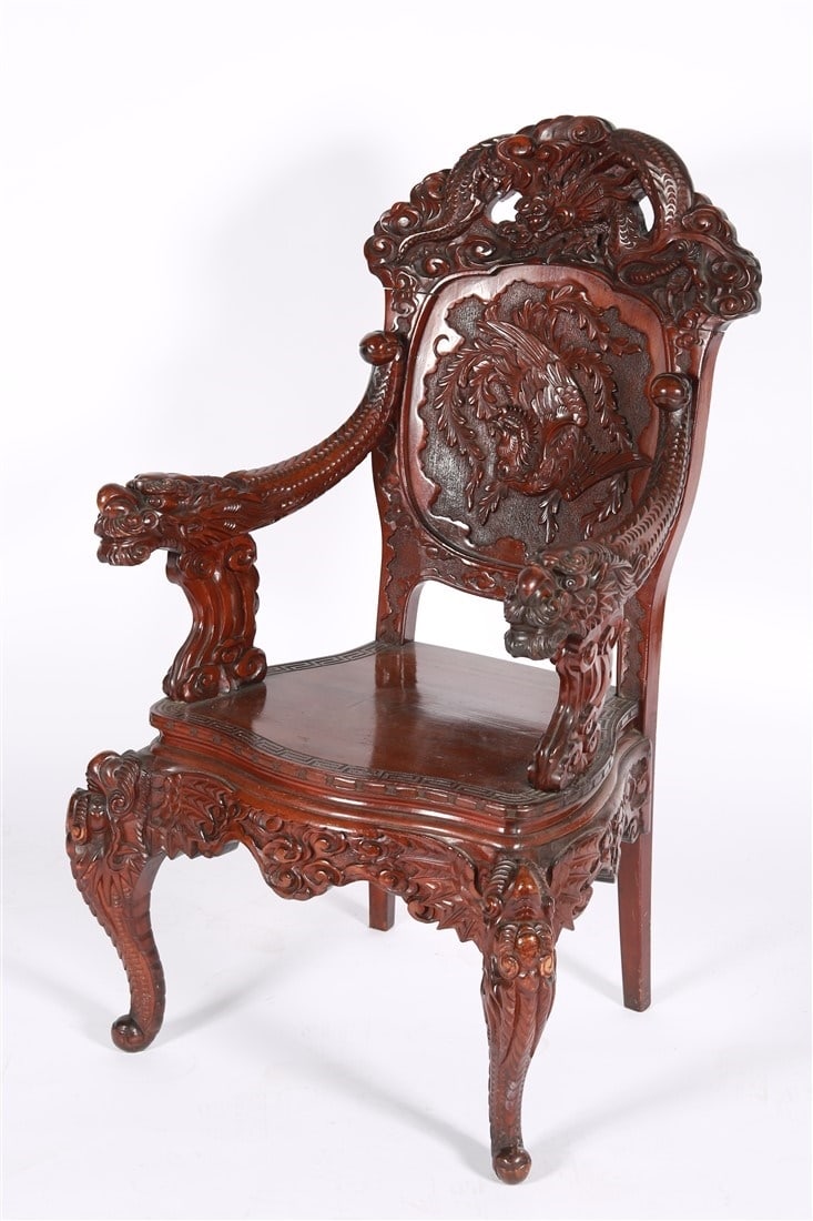 Chinese Carved Mahogany Dragon Chair: Carved mahogany. Height: 43 1/2", Length: 24", Depth: 23". Chinese carved mahogany chair with dragon and pheasant motifs.