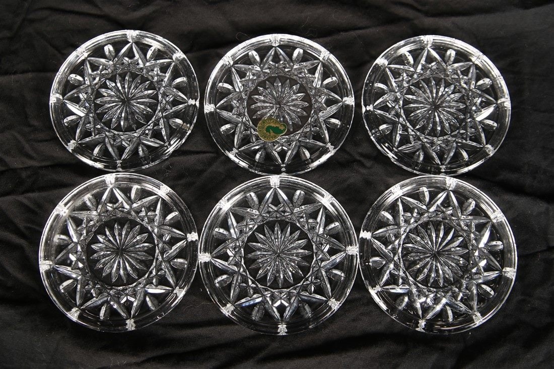 Waterford, Set of Six "Lismore" Coasters: Waterford (Irish, established 1783). "Lismore". Crystal. Diameter: 4". Set of six Waterford "Lismore" coasters. With etched Waterford insignia, and one with a Waterford sticker.