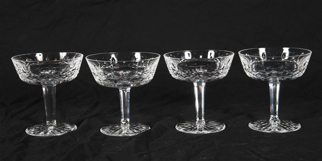Waterford, Four "Lismore" Champagne/Sherbets: Waterford (Irish, established 1783). "Lismore". Crystal. Height: 4 1/8". Collection of four Waterford "Lismore" champagne/sherbet glasses. Three glasses are the same size with a diameter of 3 3/4", on