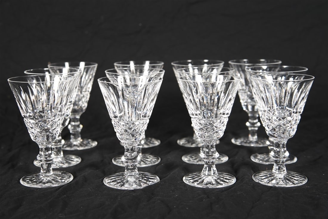 Waterford, Set of Twelve "Tramore" Wine Wine Glass: Waterford (Irish, established 1783). "Tramore". Crystal. Height: 5". Set of twelve Waterford "Tramore" crystal white wine glasses. Etched Waterford insignia to the undersides.