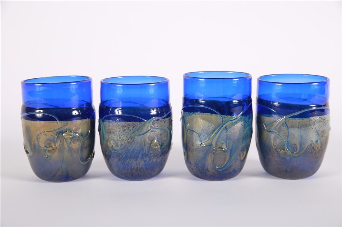 Frederick Warren, Set of Four Glasses: Frederick Warren (American, 20th century). Glass. Height: 5", Diameter: 3 1/2". Set of four hand-blown glass cups by American artisan Frederick Warren. Blue and iridescent. Signed to the undersides.