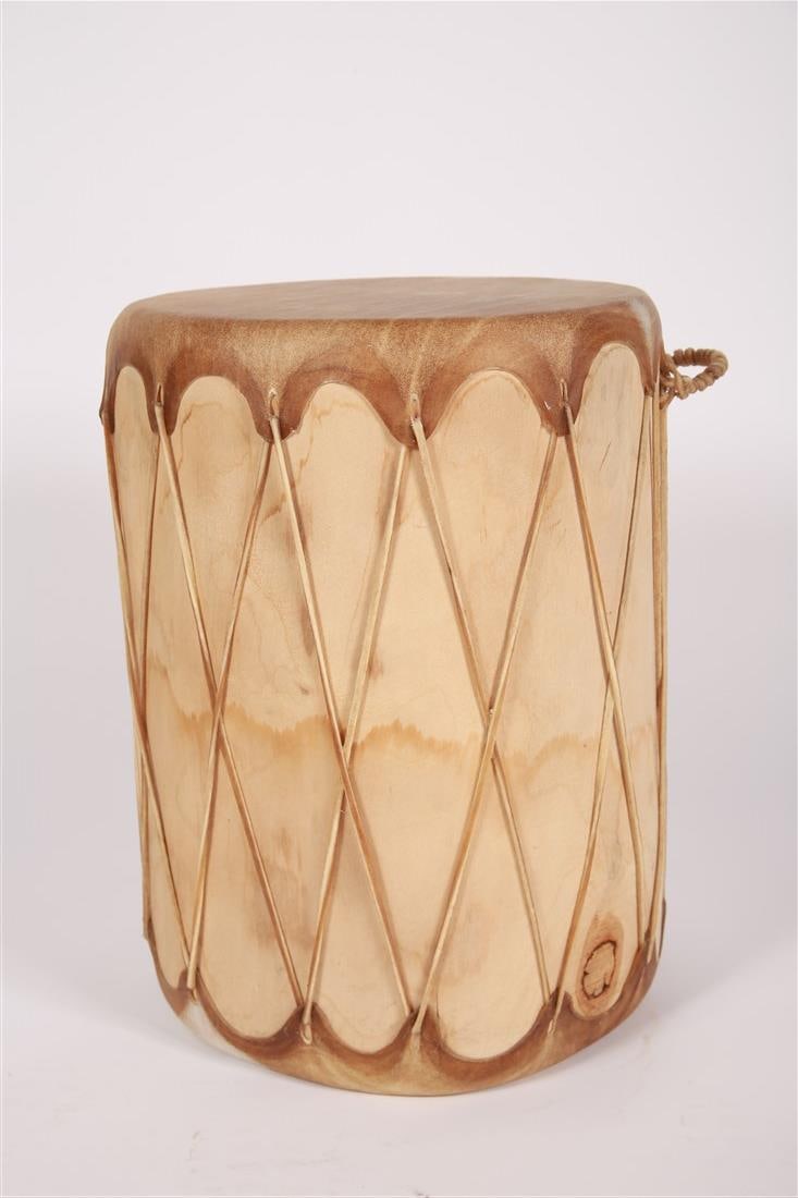 Native American Rawhide Log Drum: Rawhide. Height: 20 1/4", Diameter (including handle): 17 1/4". Native American rawhide log drum.