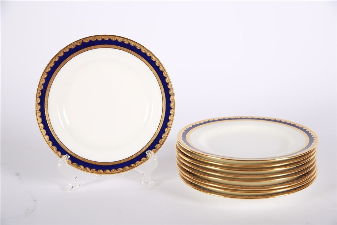 Tiffany & Co., Set of Nine Bread and Butter Plates: Tiffany and Co. (American, established 1837). Porcelain. Diameter: 6 1/4". Set of nine Tiffany & Co. bread and butter plates. White with blue and gold gilt trim. Marked "Tiffany & Co. New York Made in