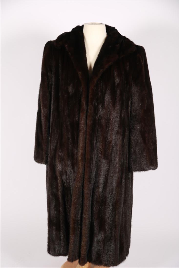 Kay Anos Furs, Full Length Black Mink: Kay Anos Furs. Black mink. Full-length black mink coat by Kay Anos Furs. Fancy embroidered lining. No size or content tags. Pit to pit interior measurement: 19". If you would like additional measureme