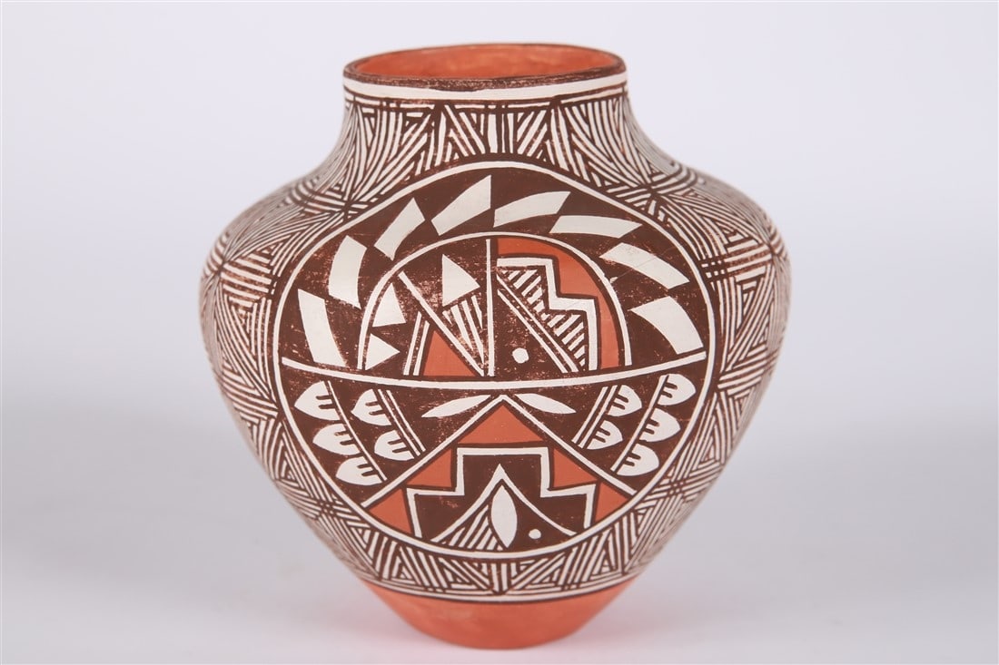 Juana Leno, Acoma Polychrome Pottery: Juana Leno (Acoma, 1917-2000). Polychrome pottery. Height: 5 1/4", Diameter: 5 1/4". Polychrome pottery decorated with geometric forms by Acoma artist Juana Leno. Signed to the underside "Leno Acoma".