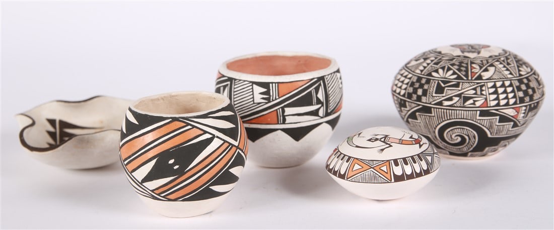 Selection of Five Acoma Pottery Pieces: Earthenware. Pot 1: Height: 3", Diameter 3 3/8". Pot 2: Height: 2 5/8", Diameter: 2 1/2". Pot 3: Height: 3 1/4", Diameter: 3 1/2". Pot 4: Height: 1 1/2", Diameter: 3". Pot 5: Height 1 1/2", Diameter: