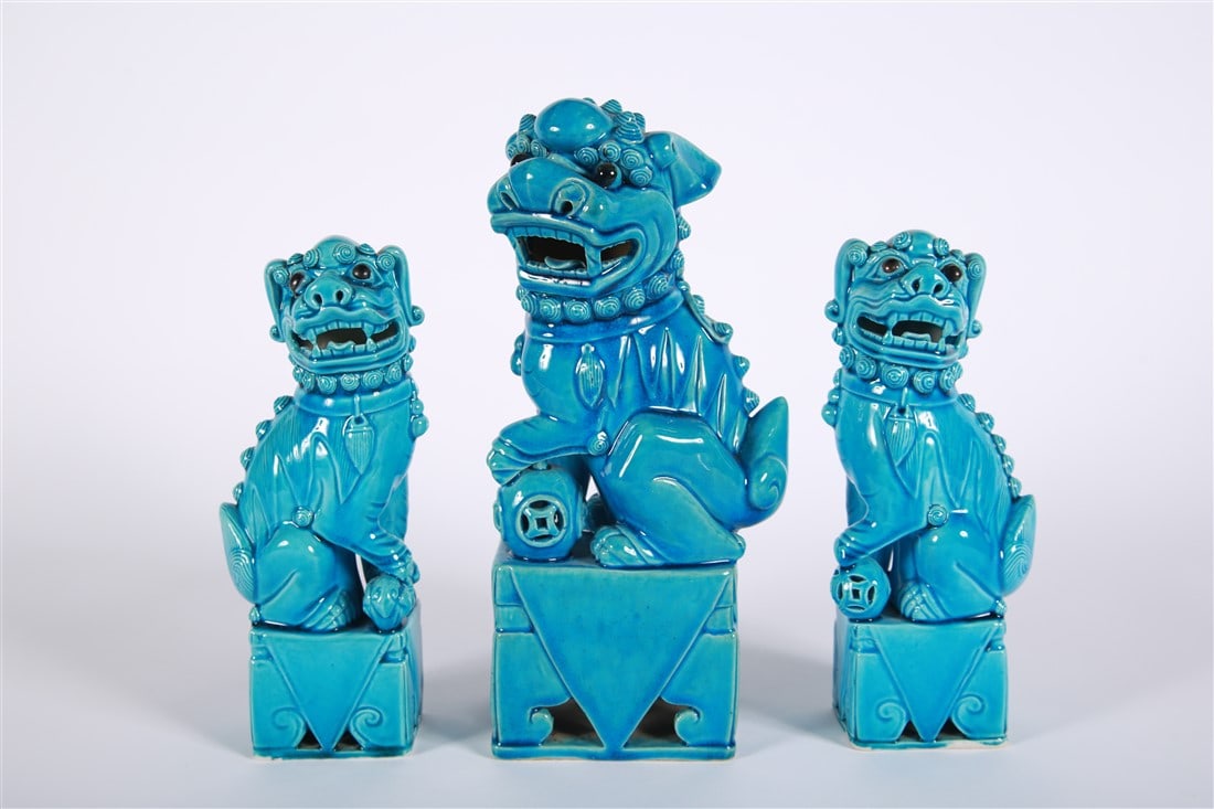 Coll. of Three Blue Porcelain Chinese Foo Dogs: Porcelain. Tallest: Height: 11 1/2", Length: 5 1/2", Depth: 3 1/2". Shorter pair: Height: 9 1/8", Length: 3 3/4", Depth: 2 1/4". Collection of three blue turquoise porcelain Chinese foo dog sculptures
