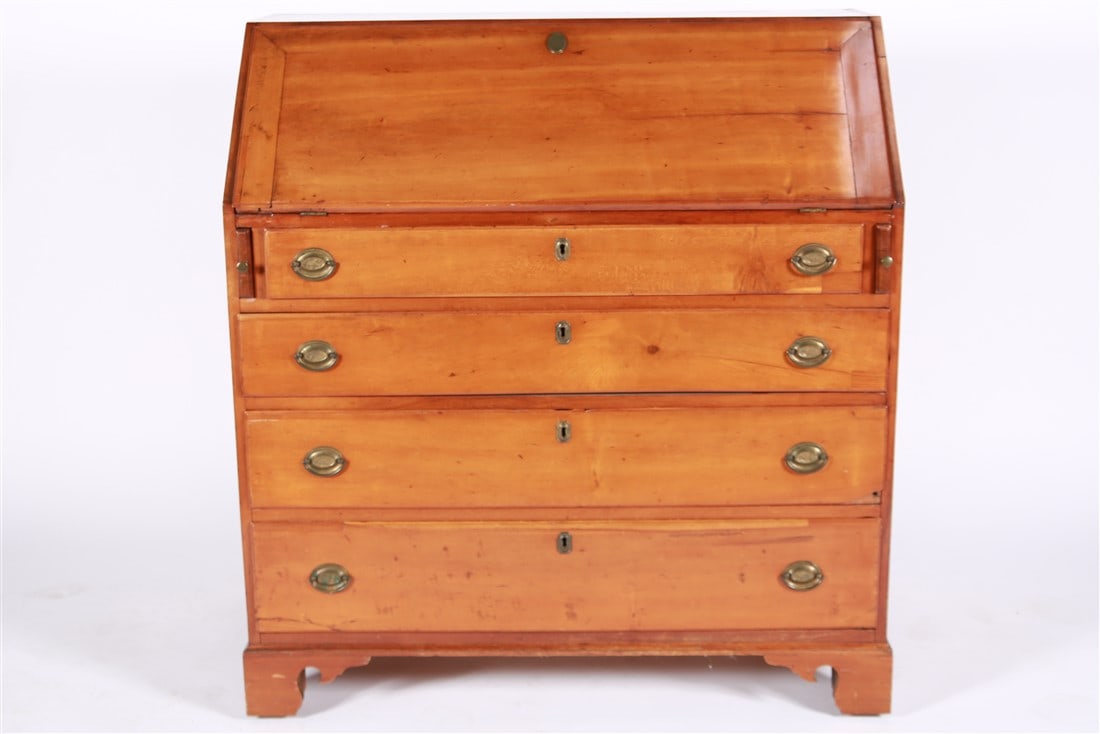 Maple Slant-Front Secretary: Maple, brass. Height: 42", Length: 40", Depth: 20 3/4". Hepplewhite style slant-front secretary with four drawers. Interior of desk with six drawers flanking a central lockable door hiding four drawer