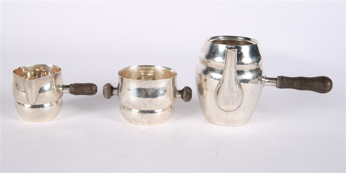Georg Jensen, Sterling Silver Coffee Set: Georg Jensen (Danish, established 1904). Sterling silver, wood. Tallest piece: Height: 4 1/4", Length: 7", Depth: 4 1/2". Shortest piece: Height: 2 1/2", Length: 4 1/2", Depth: 3 1/4". Total weight
