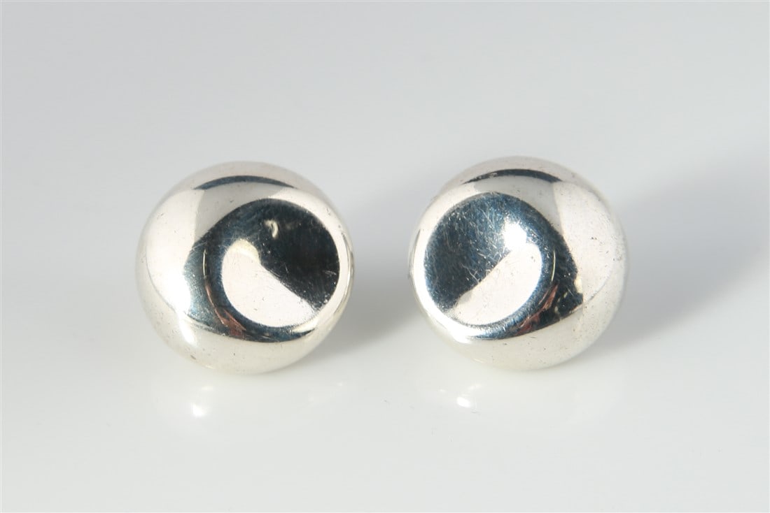 Elsa Peretti for Tiffany "Thumbprint" Earrings: Tiffany and Co. circular thumbprint sterling silver earrings designed by Elsa Peretti. Earrings are stamped "Tiffany & Co., Elsa Peretti, 925 Spain". Earrings weigh a total of 1.420 ozt.