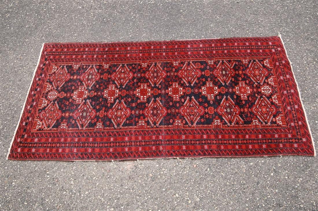 Pakistani Bokhara Rug, c. 1980s: Pakistan. Machine-spun wool, c. 1980s. 6'7" x 3'4". Pakistani Bokhara rug in red, black, and cream colors.