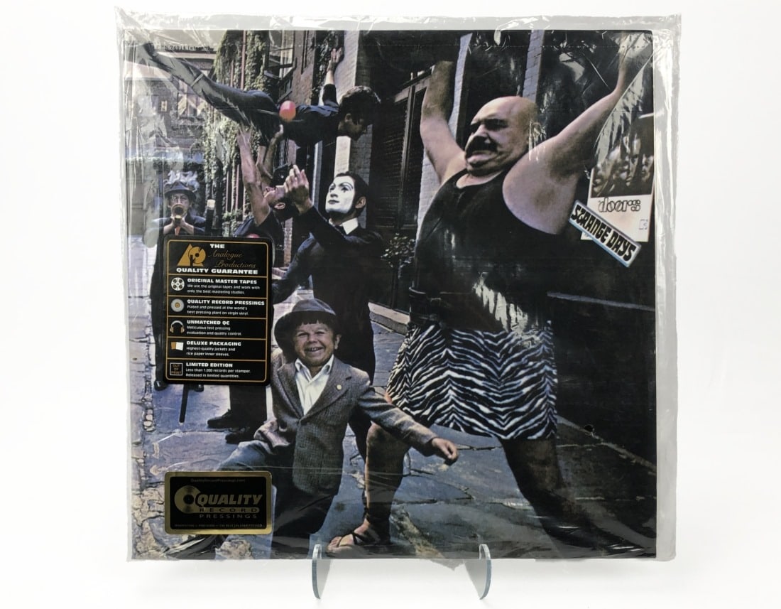 Analogue Productions The Doors/Strange Days: Analogue Productions. The Doors/Strange Days. Still sealed in original loose bag. Perforation intact.