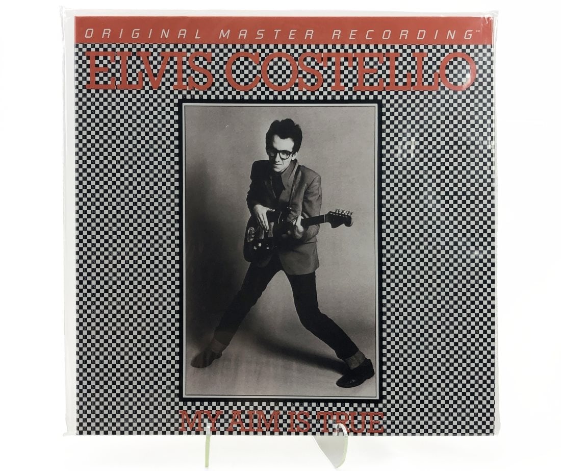 MFSL Elvis Costello/My Aim Is True: Mobile Fidelity Sound Lab. Elvis Costello/My Aim Is True. Still sealed in original loose bag. Perforation intact. Special limited edition No. 5893.