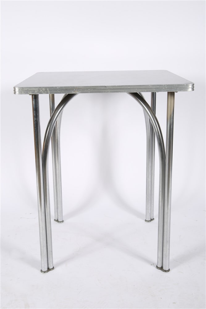 Chrome and Formica Square Table: Chrome, Formica. Height: 29", Length: 24", Depth: 24". Chrome table with black Formica top.