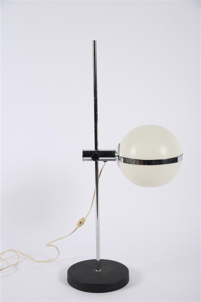 Italian Mid-Century Acrylic Globe Table Lamp: Metal, acrylic. Height: 31", Length: 12", Base diameter: 8". Italian "eyeball" style table lamp comprised of a white acrylic globe bisected by a chrome band and mounted on a metal stem. Adjustable lig