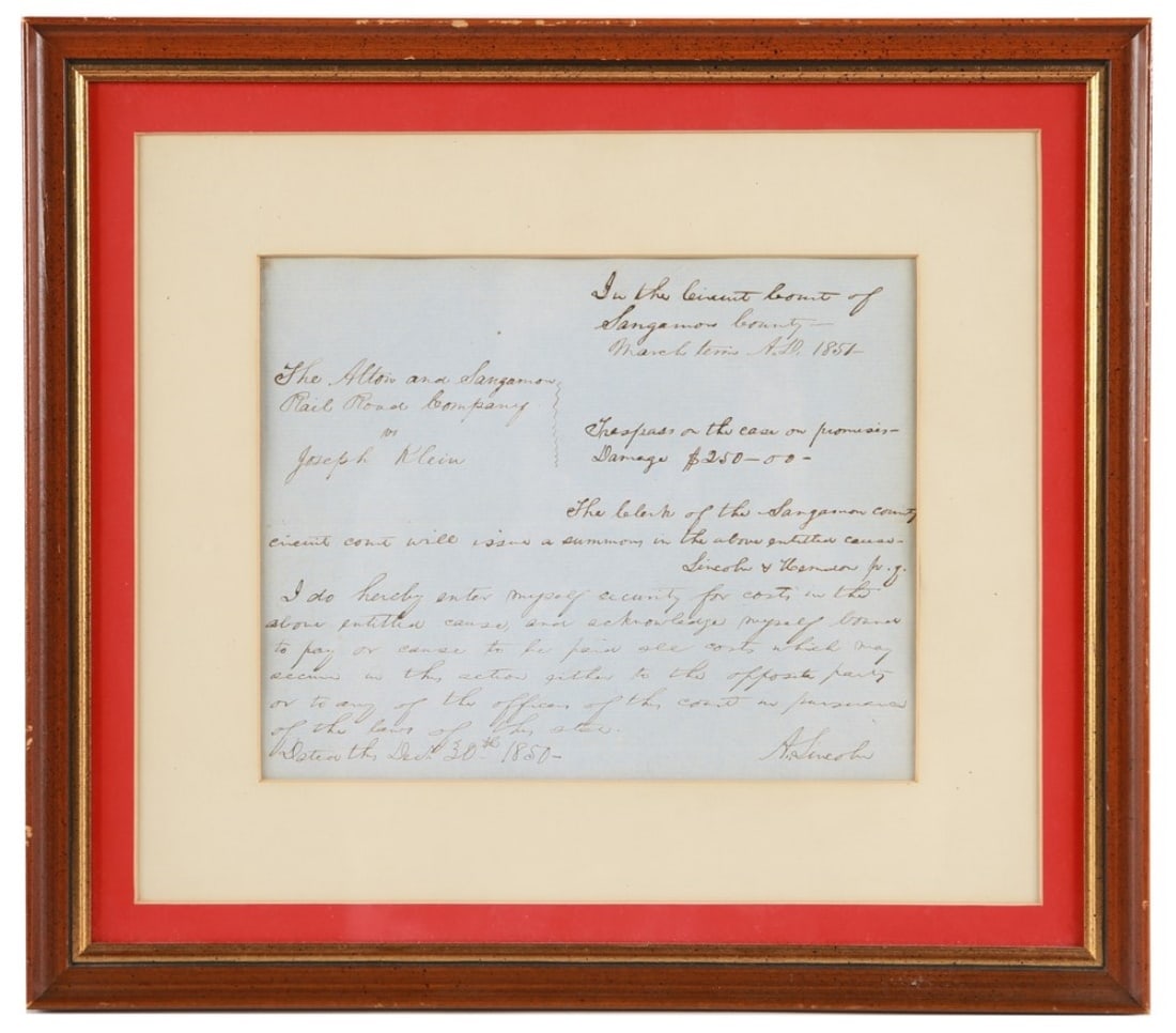 Abraham Lincoln Signed Handwritten Court Summons: Frame: 12 1/4" x 13 3/4". Sight: 6 1/2" x 8 1/4". Abraham Lincoln handwritten legal document, c. 1850-51. Document instructs the clerk in the Sangamon County Circuit Court to issue a summons in the
