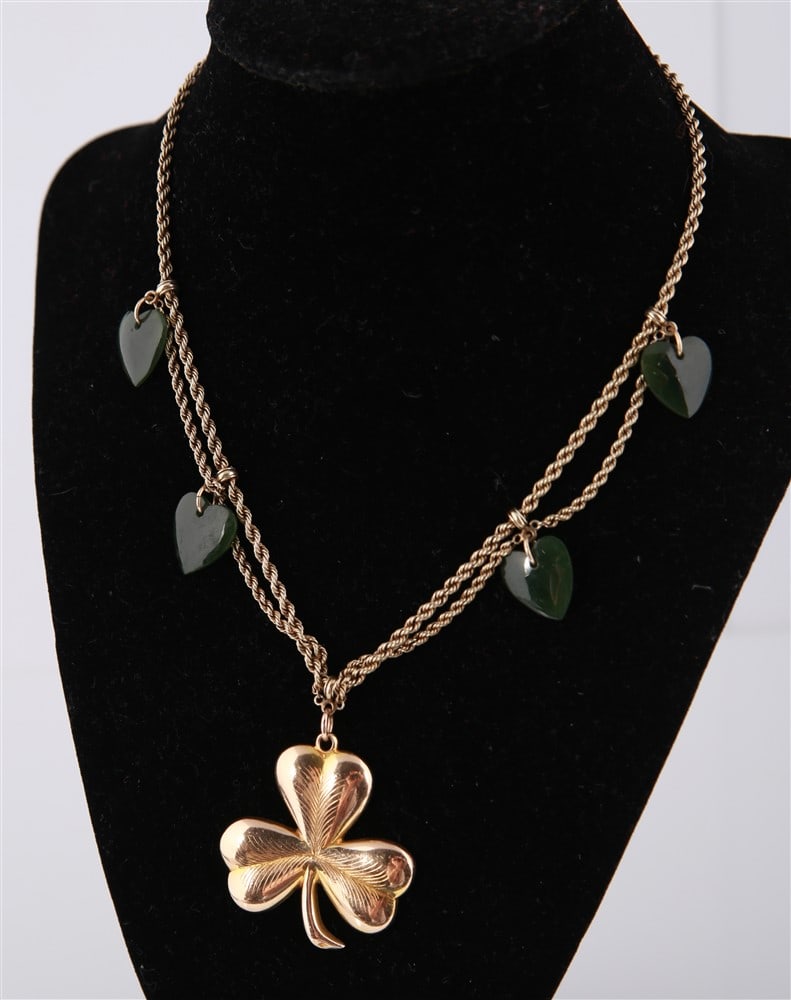 15k Yellow Gold Shamrock Pendant Necklace, 1904: 15k yellow gold shamrock pendant necklace with heart-shaped nephrite stones. Shamrock is inscribed, "Presented to Lily Foley by the Committee of her Farewell Concert on her Departure to St. Louis 1904