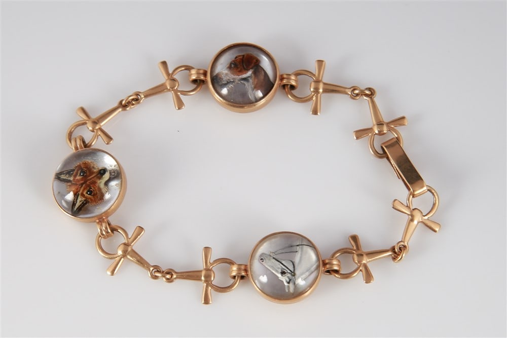 14k Yellow Gold Reverse Painted Fox Hunt Bracelet: 14k yellow gold, crystal. Length: 7 1/2". Weight: 14 grams. 14K yellow gold bracelet set with three reverse painted crystal domes, each hand painted with an animal head (horse, fox, dog). Each dome ha