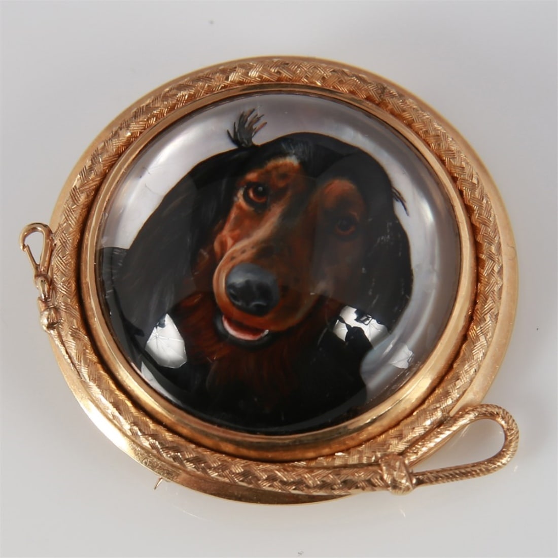 14k Yellow Gold Reverse Painted Dog Brooch: 14k yellow gold, crystal. 36.0 mm round. Hand painted crystal dome brooch with a dog head design and dog leash design frame. The back is yellow gold and is marked "14K".