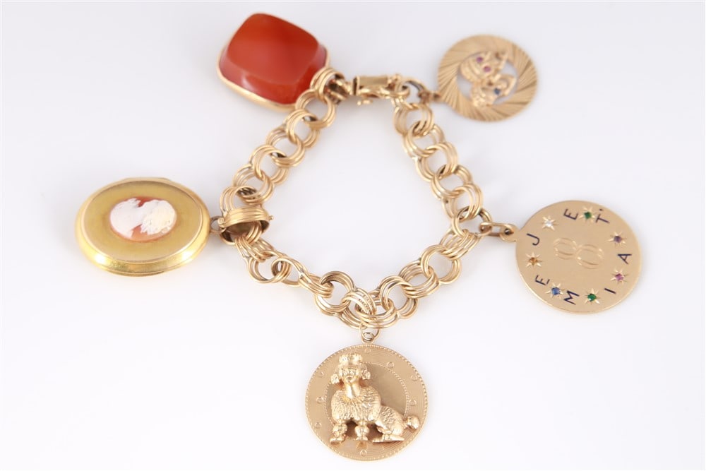 14k/10k Yellow Gold Bracelet With Five Fob Charms: Yellow gold, stones. Length: 7 1/2". Weight: 79.2 grams. 14K yellow gold fancy link bracelet with a spring ring clasp and five gold fob charms. Fob gemstones include agate, onyx, bloodstone, and sardo