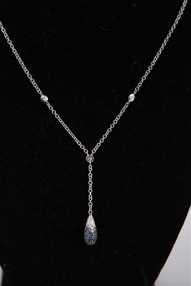 Leo Pizzo, 18k White Gold "Dew Drop" Necklace: Leo Pizzo (Italian, 20th century). 18k white gold, sapphire, diamond. Chain length: 16", Pendant drop: 1 1/2". Weight including stones: 5.2 grams. 18k white gold necklace set with three diamonds and a