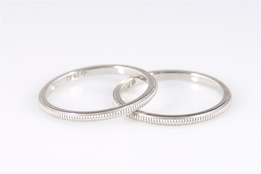 Pair of Platinum Guard Rings: Platinum. Ring size: 6. Weight: 4.5 grams. Pair of platinum guard rings. Rings are a size 6 and marked "PLAT". Total weight: 4.5 grams.