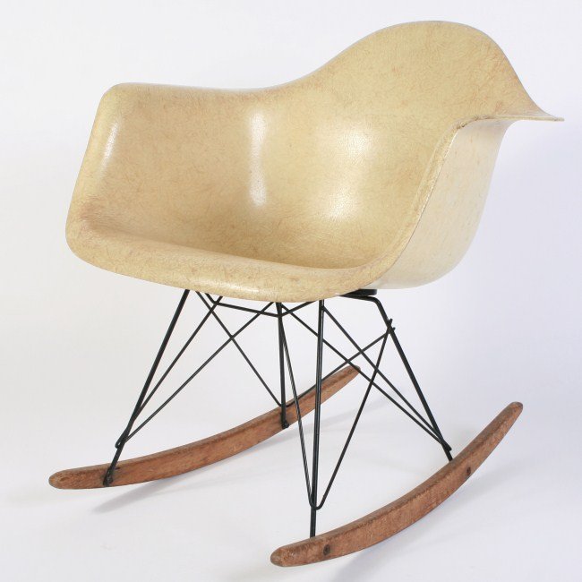 Charles and Ray Eames Shell Rocking Chair, 20th C.: Charles and Ray Eames shell rocking chair. By Herman Miller. American, 20th century. With molded cream fiberglass seat raised on metal base and wooden runners. Height 27", width 24", depth 27 1/2". Co