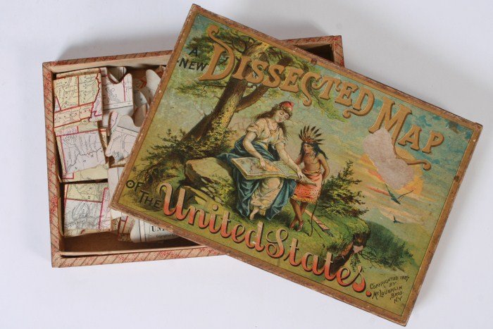 McLoughlin Brothers Wood Puzzle, W/ Another Puzzle: McLouglin Brothers wood puzzle. American, late 19th, early 20th century. A new dissected map of the United States. Together with another puzzle of "Our Lord's Miracles". Condition: Both with discolore