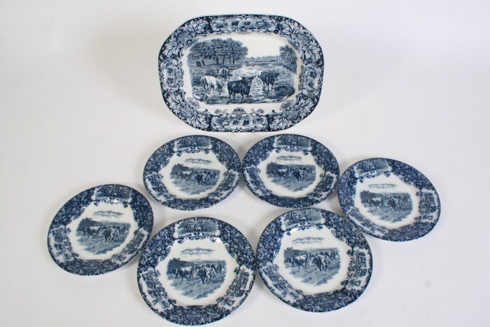 Wedgwood Ironstone Platter with 6 Plates: Wedgwood ironstone blue and white decorated platter wit six plates. English, late 19th century, early 20th century. Transfer decorated with cows in landscape. Platter length 16 1/2", plate diameter 10