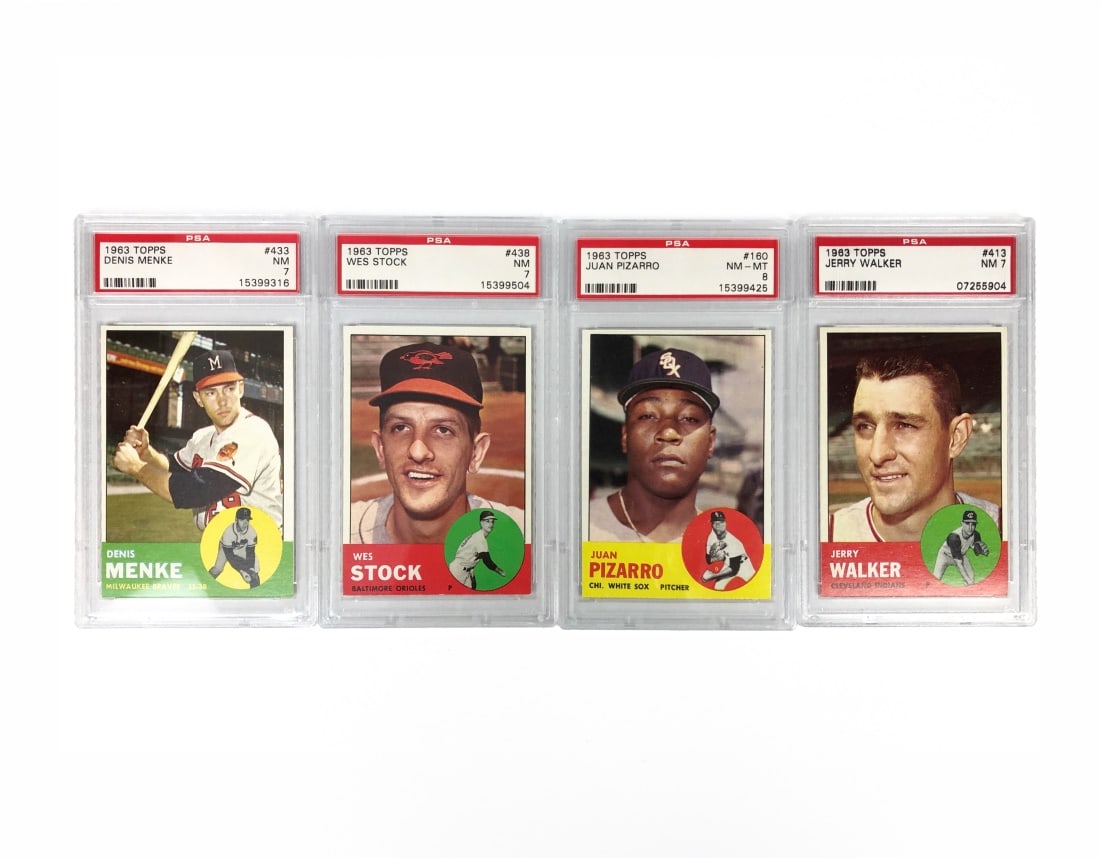 Set of 4 PSA Graded 1963 Topps Baseball Cards: All four cards are by Topps for the 1963 MLB seasons. All cards have been graded and slabbed by PSA. Included players: Dennis Menke - PSA 7 Wes Stock - PSA 7 Juan Pizarro PSA 8 Jerry Walker - PSA 7