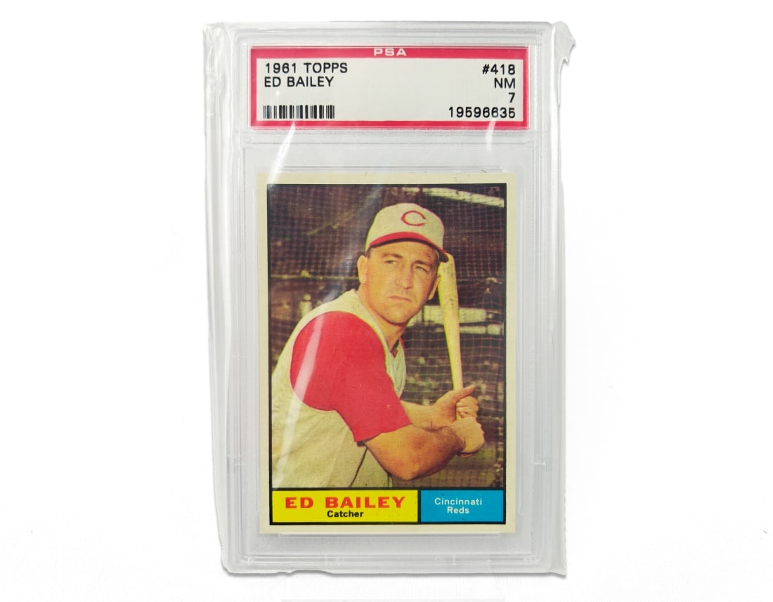 1961 Topps Ed Bailey Baseball Card - PSA 7: An Ed Bailey baseball card for the 1961 MLB season by Topps. The card has been slabbed and graded a 7 by PSA.