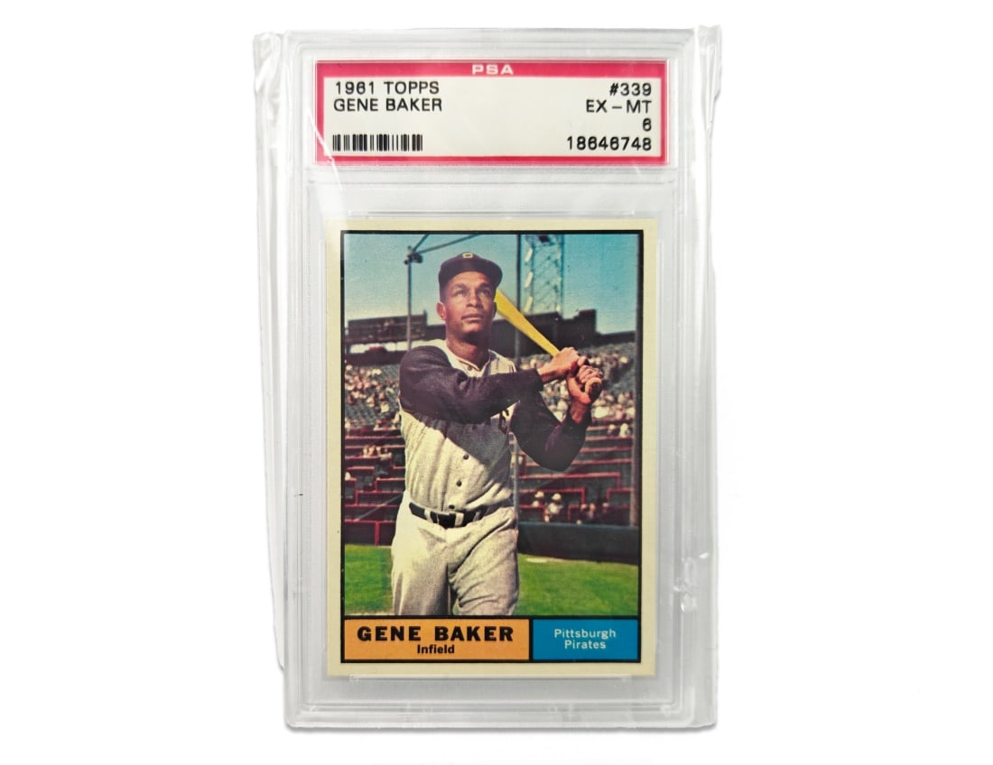 1961 Topps Gene Baker Baseball Card - PSA 6: A Gene Baker baseball card for the 1961 MLB season by Topps. The card has been slabbed and graded a 6 by PSA.