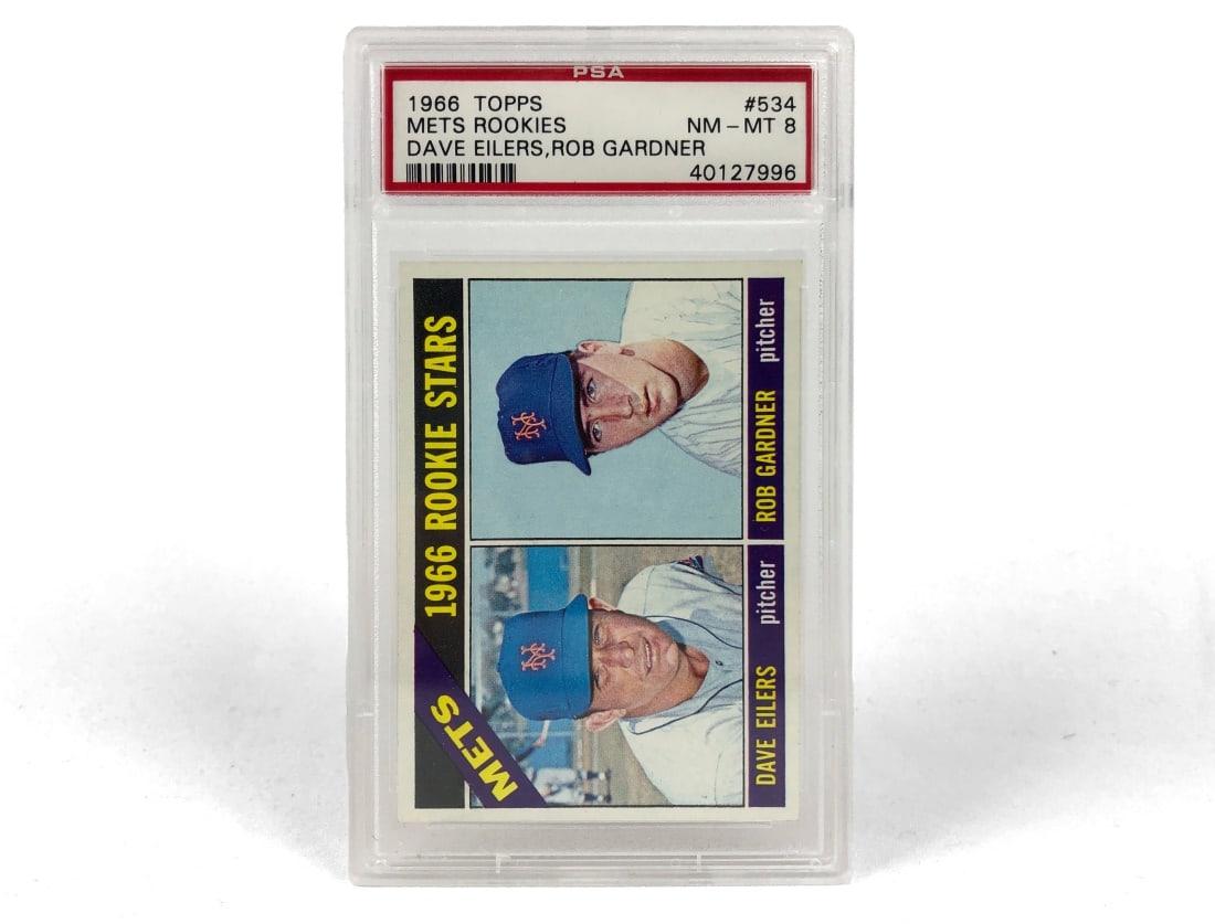 1966 Topps Mets Rookies Baseball Card - PSA 8: A 1966 Mets Rookies MLB baseball card by Topps featuring Dave Eilers and Rob Gardner. It has been slabbed and graded a 7 by PSA.