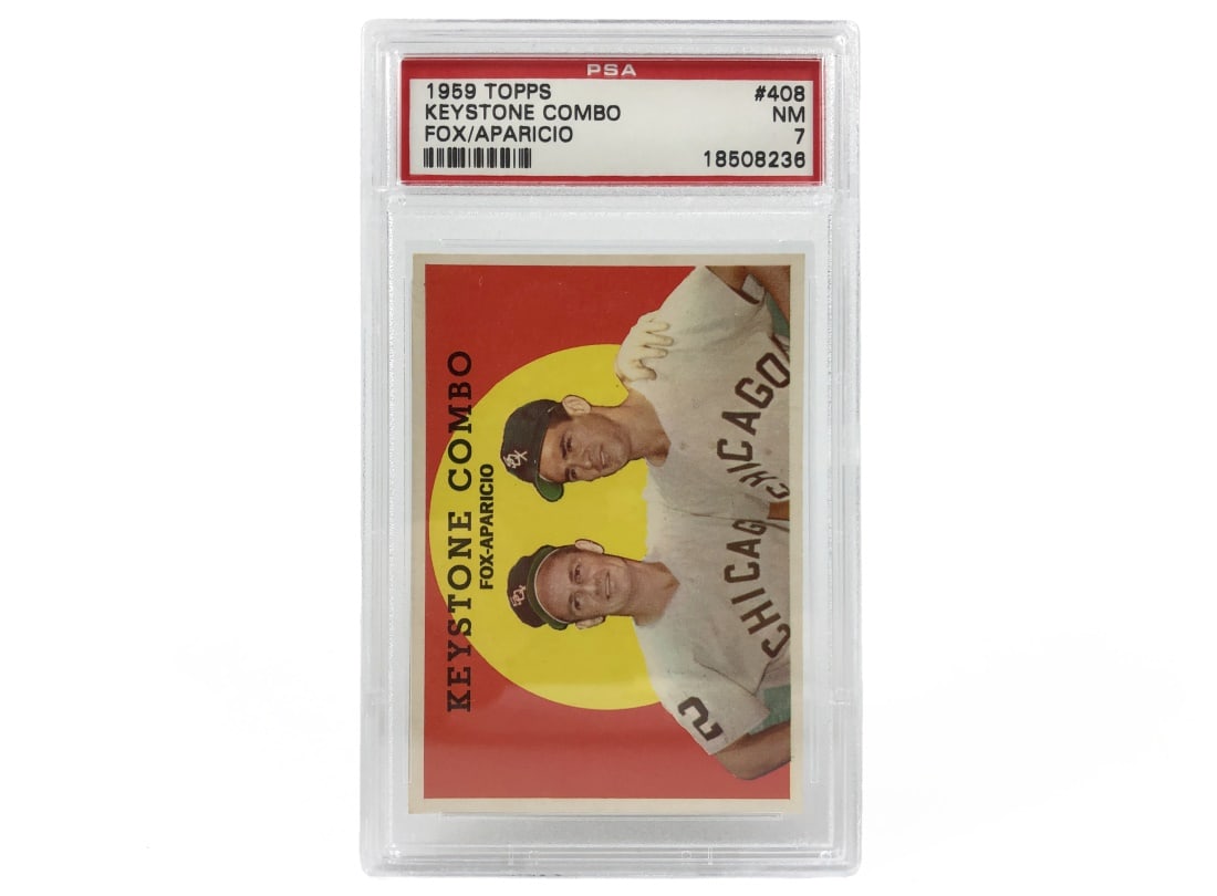 1959 Topps Keystone Combo Baseball Card - PSA 7: A 1959 "Keystone Combo" MLB baseball card featuring Nellie Fox and Luis Aparicio by Topps that has been slabbed and graded a 7 by PSA.