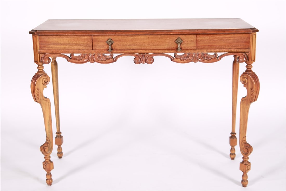 Wood Bureau Plat Desk: Wood, metal. Height: 30 3/4", Length: 39 1/2", Depth: 15". Wood bureau plat desk with one drawer and metal pulls standing on carved legs.