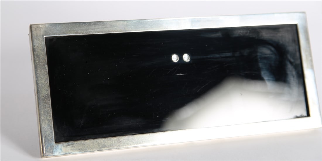 Tiffany & Co., Sterling Silver Photo Frame: Tiffany & Co. (American, established 1837). Sterling silver, glass. Height: 4 3/8", Length: 10 1/2", Depth: 1/4". Sterling silver frame from Tiffany & Co. Bottom is marked "Tiffany and Co., Sterling,