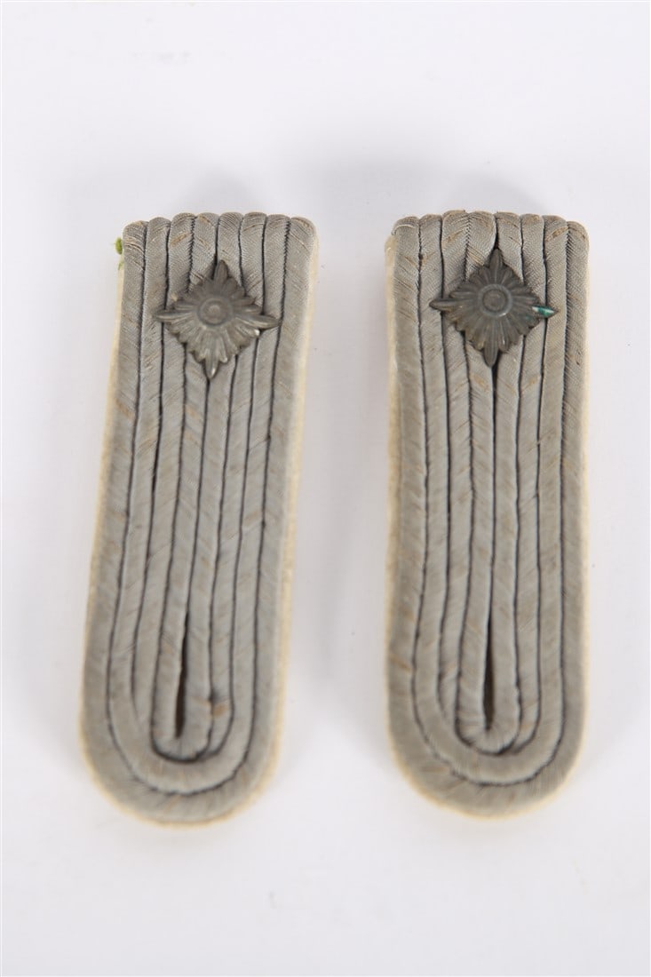 World War II Pair of German Army Shoulder Boards: World War II pair of Germany army shoulder boards. No insignia. White piping. 4" x 1 1/2".