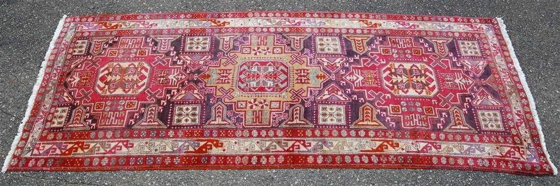 Caucasian Karabagh Wool Rug: Caucasian Karabagh. Wool, c. 1980s-1990s. 4'4" x 10'2". Wool Karabagh rug in pink, purple, and cream colors.
